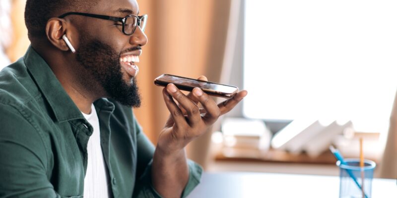 Photo of a Man Speaking Into His Phone